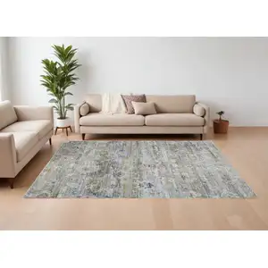 Photo of Ivory Green and Blue Floral Power Loom Worn Faded Area Rug