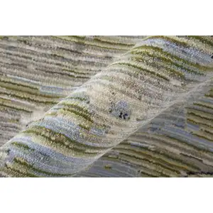 Photo of Ivory Green and Blue Floral Power Loom Worn Faded Area Rug