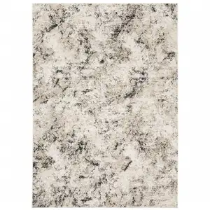 Photo of Ivory Grey Black Beige And Tan Abstract Power Loom Stain Resistant Area Rug