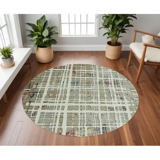 8' Ivory Round Abstract Area Rug Photo 1