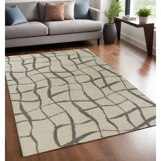 Ivory Machine Woven Abstract Indoor Shag Rug Photo 1