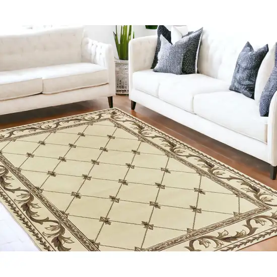 8'X11' Ivory Machine Woven Hand Carved Fleur De Lis Indoor Area Rug Photo 1