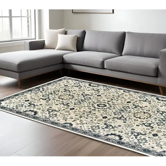 Ivory and Blue Oriental Power Loom Area Rug Photo 1