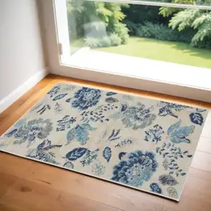 Photo of Ivory Navy Blue And Light Blue Floral Area Rug