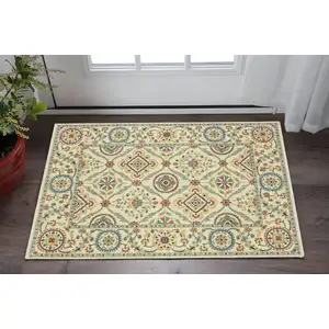 Photo of Ivory Orange And Blue Oriental Area Rug With Fringe