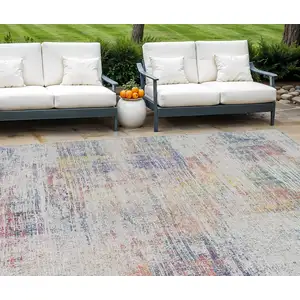 Photo of Ivory Orange And Blush Abstract Washable Indoor Outdoor Area Rug