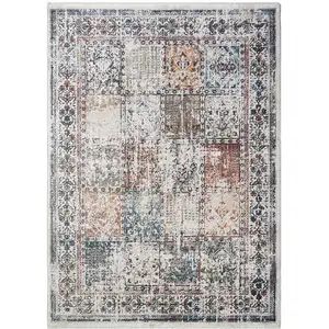 Photo of Ivory Oriental Distressed Area Rug With Fringe