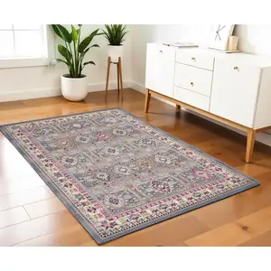 Photo of Ivory Pink And Gray Floral Distressed Area Rug