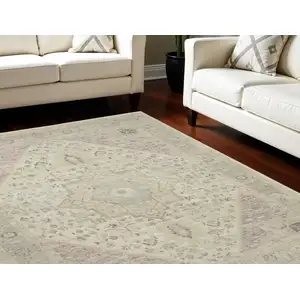 Photo of Ivory Pink And Gray Floral Medallion Distressed Area Rug