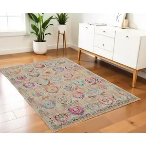 Photo of Ivory Pink And Orange Floral Distressed Area Rug