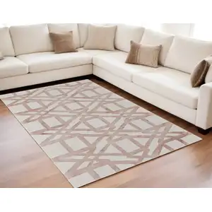 Photo of Ivory Pink and Tan Wool Geometric Hand Tufted Area Rug