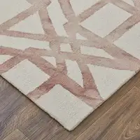 Photo of Ivory Pink and Tan Wool Geometric Hand Tufted Area Rug