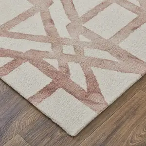 Photo of Ivory Pink and Tan Wool Geometric Hand Tufted Area Rug