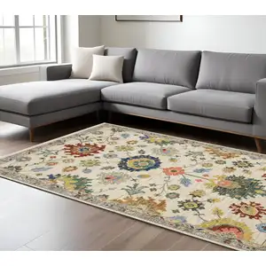 Photo of Ivory Red And Blue Oriental Area Rug With Fringe