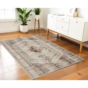 Photo of Ivory Red And Orange Floral Distressed Area Rug