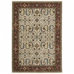 Photo of Ivory Red Green Grey Blue And Navy Oriental Power Loom Stain Resistant Area Rug With Fringe