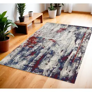 Photo of Ivory Red and Blue Abstract Area Rug