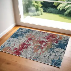 Photo of Ivory Red and Blue Abstract Distressed Non Skid Area Rug