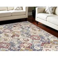 Photo of Ivory Red and Blue Geometric Distressed Area Rug