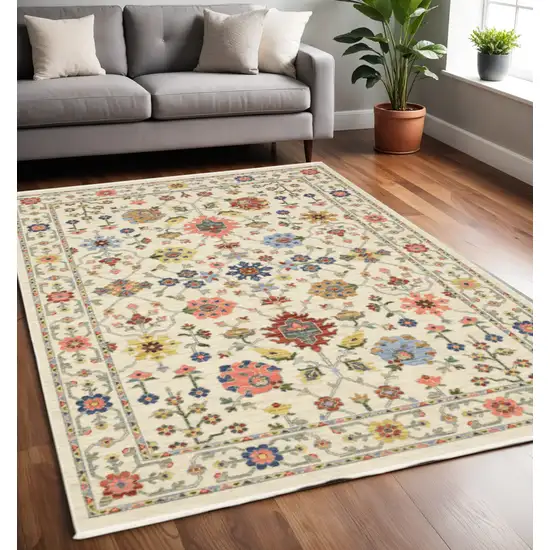 Ivory and Blue Oriental Power Loom Area Rug With Fringe Photo 1