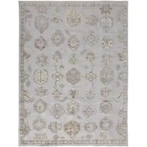 Photo of Ivory Silver And Tan Floral Hand Knotted Stain Resistant Area Rug