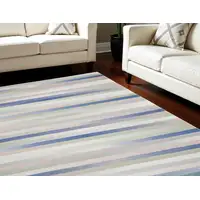 Photo of Ivory Tan and Blue Abstract Distressed Non Skid Area Rug