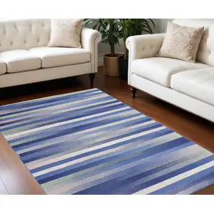 Photo of Ivory Tan and Blue Abstract Distressed Non Skid Area Rug