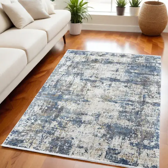 Ivory Tan and Blue Abstract Power Loom Area Rug With Fringe Photo 1