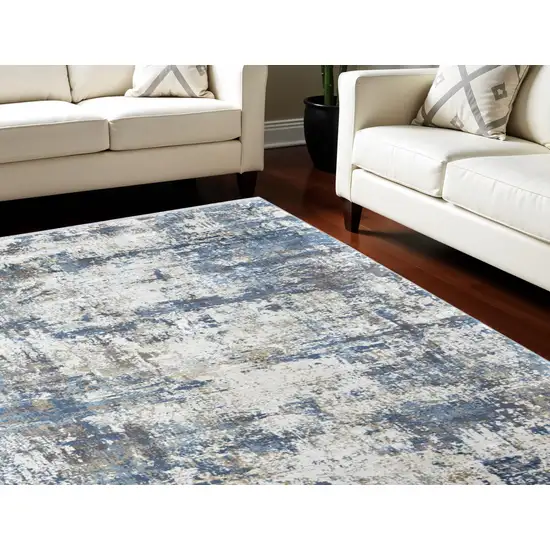 Ivory Tan and Blue Abstract Power Loom Area Rug With Fringe Photo 1