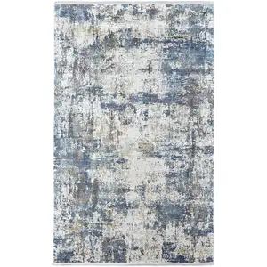 Photo of Ivory Tan and Blue Abstract Power Loom Area Rug With Fringe