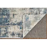 Photo of Ivory Tan and Blue Abstract Power Loom Area Rug With Fringe