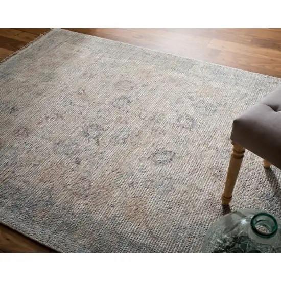 Ivory Tan and Blue Floral Hand Woven Distressed Area Rug With Fringe Photo 9