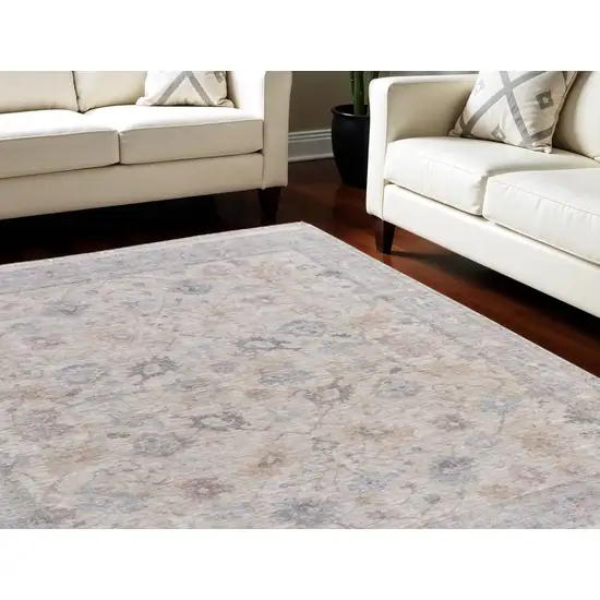 Ivory Tan and Blue Floral Hand Woven Distressed Area Rug With Fringe Photo 1