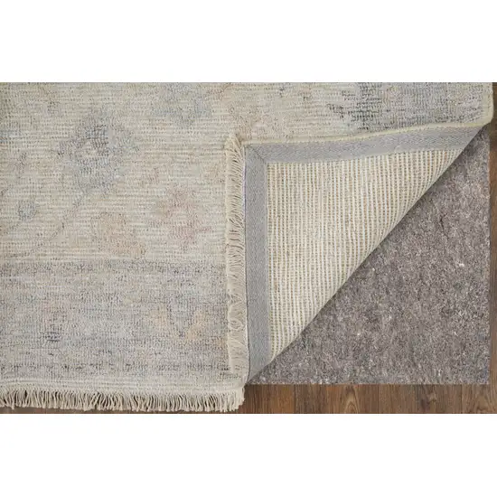 Ivory Tan and Blue Floral Hand Woven Distressed Area Rug With Fringe Photo 8