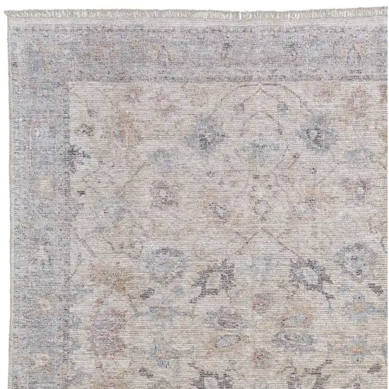 Ivory Tan and Blue Floral Hand Woven Distressed Area Rug With Fringe Photo 4