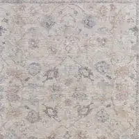 Photo of Ivory Tan and Blue Floral Hand Woven Distressed Area Rug With Fringe