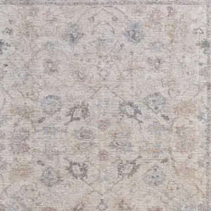 Photo of Ivory Tan and Blue Floral Hand Woven Distressed Area Rug With Fringe