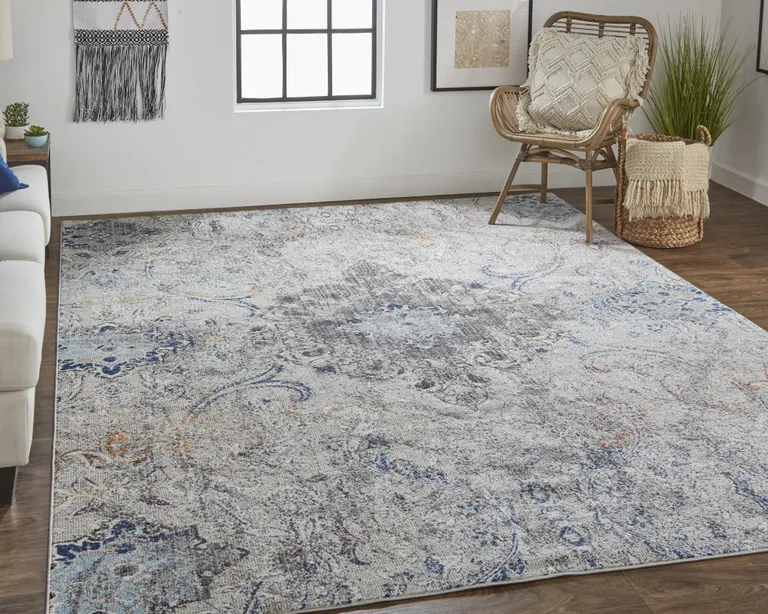 Ivory Taupe And Blue Floral Power Loom Distressed Stain Resistant Area Rug Photo 1