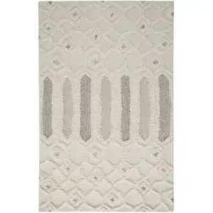 Photo of Ivory Taupe And Tan Wool Geometric Tufted Handmade Stain Resistant Area Rug