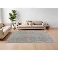 Photo of Ivory Taupe and Blue Abstract Power Loom Worn Faded Area Rug With Fringe