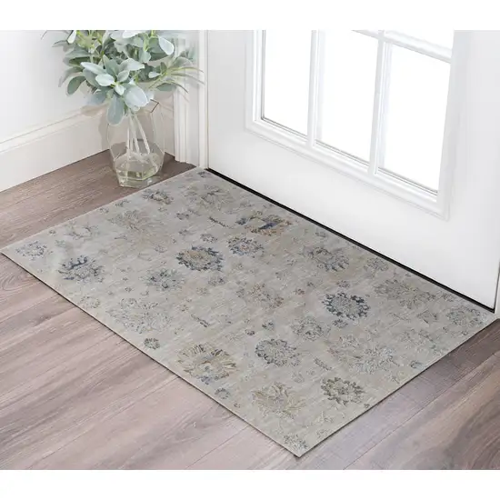 Ivory Taupe and Blue Floral Power Loom Worn Faded Area Rug With Fringe Photo 1