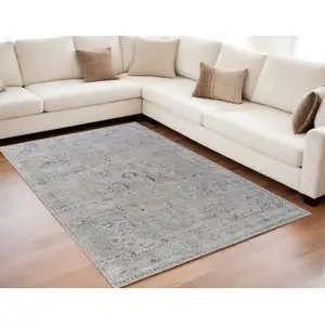 Photo of Ivory Taupe and Blue Oriental Power Loom Worn Faded Area Rug With Fringe