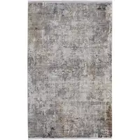 Photo of Ivory Taupe and Gray Abstract Power Loom Distressed Area Rug With Fringe