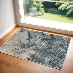 Photo of Ivory Teal Blue and Black Abstract Area Rug