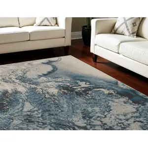 Photo of Ivory Teal Blue and Black Abstract Non Skid Area Rug