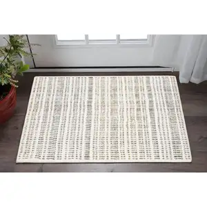 Photo of Ivory Yellow And Black Striped Area Rug