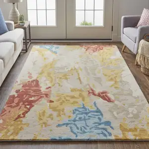 Photo of Ivory Yellow And Blue Wool Abstract Tufted Handmade Stain Resistant Area Rug