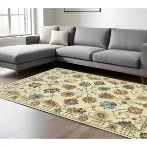 Photo of Ivory Yellow And Orange Oriental Area Rug With Fringe