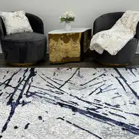 Photo of Ivory and Blue Abstract Area Rug