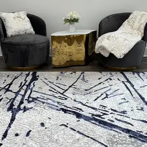 Photo of Ivory and Blue Abstract Area Rug